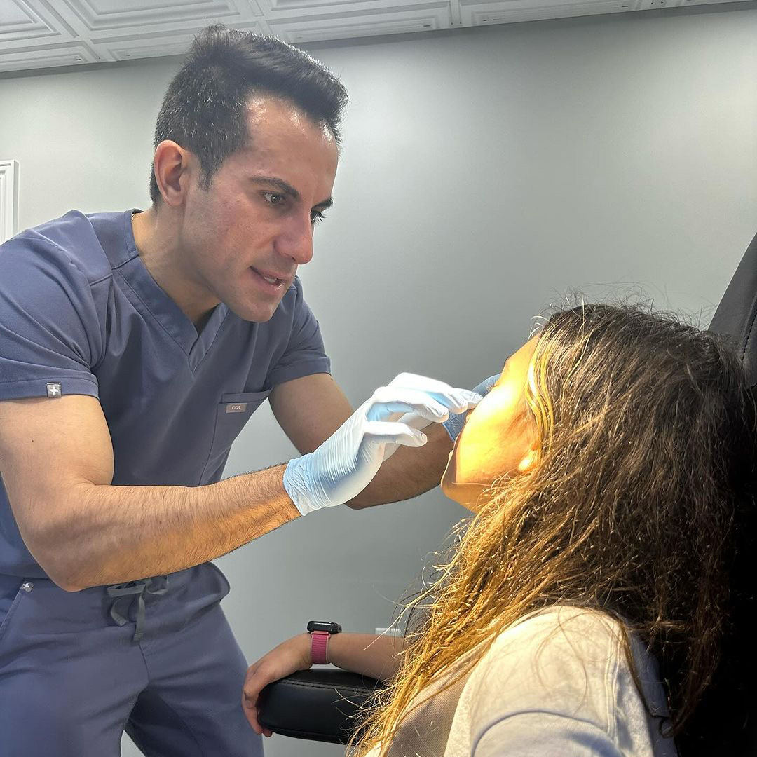 Dr. Nouri with a patient